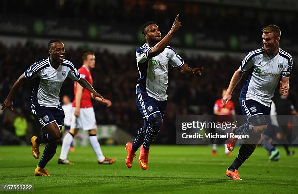 Stephane Sessegnon of West Bromwich Albion celebrates with Saido Berahino and Chris Brunt as he scores their first goal during the Barclays Premier...