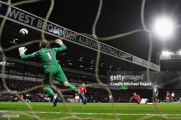 Stephane Sessegnon of West Bromwich Albion shoots past goalkeeper David De Gea of Manchester United to score their first goal during the Barclays...