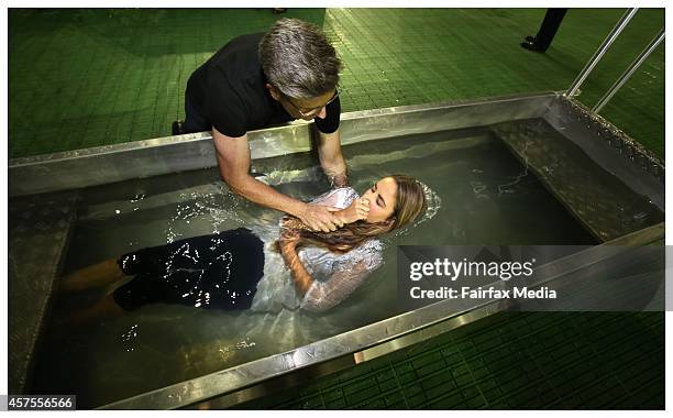 Mass baptism is held at the International Convention of Jehovahs Witnesses at Etihad Stadium in Melbourne, October 18, 2014. The event attracted...