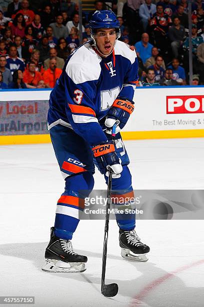Travis Hamonic of the New York Islanders skates against the San Jose Sharks at Nassau Veterans Memorial Coliseum on October 16, 2014 in Uniondale,...