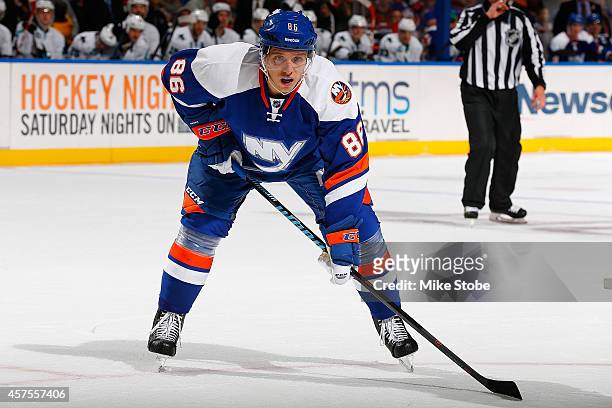 Nikolai Kulemin of the New York Islanders skates against the San Jose Sharks at Nassau Veterans Memorial Coliseum on October 16, 2014 in Uniondale,...