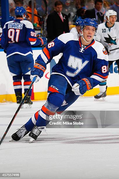 Nikolai Kulemin of the New York Islanders skates against the San Jose Sharks at Nassau Veterans Memorial Coliseum on October 16, 2014 in Uniondale,...