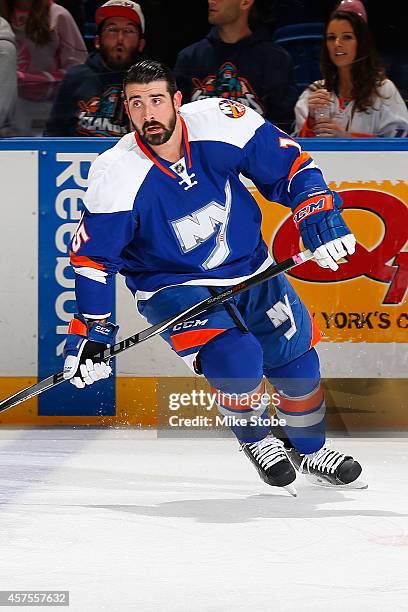 Cal Clutterbuck of the New York Islanders skates during warm-ups prior to their game against the San Jose Sharks at Nassau Veterans Memorial Coliseum...