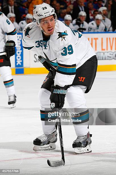 Logan Couture of the San Jose Sharks skates against the New York Islanders at Nassau Veterans Memorial Coliseum on October 16, 2014 in Uniondale, New...