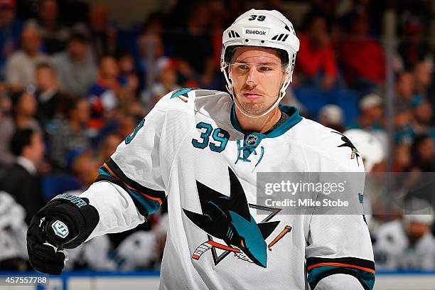 Logan Couture of the San Jose Sharks skates against the New York Islanders at Nassau Veterans Memorial Coliseum on October 16, 2014 in Uniondale, New...