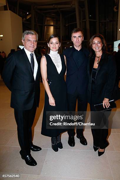 Sidney Toledano, Marion Cotillard, Raf Simons and Katia Toledano attend the Foundation Louis Vuitton Opening at Foundation Louis Vuitton on October...