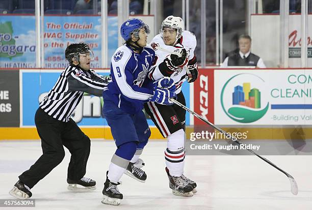 Danny Desrochers of the Sudbury Wolves and Cody Payne of the Niagara Ice Dogs have words during an OHL game between the Sudbury Wolves and the...