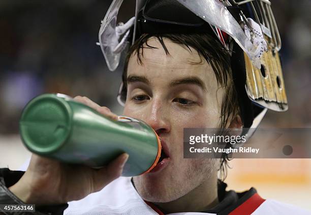 Brent Moran of the Niagara Ice Dogs has a drink during an OHL game between the Sudbury Wolves and the Niagara Ice Dogs at the Meridian Centre on...