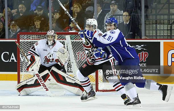 Brent Moran of the Niagara Ice Dogs keeps his eye on the puck during an OHL game between the Sudbury Wolves and the Niagara Ice Dogs at the Meridian...