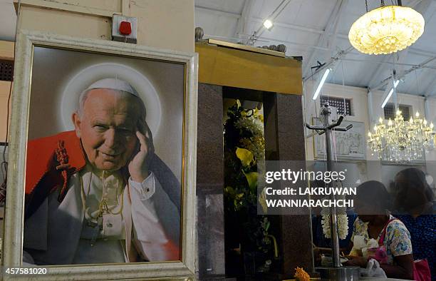 Portrait of Pope John Paul II is pictured at the highly venerated St. Anthonys Shrine, where he made an unscheduled visit to the church in January...