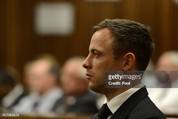 Oscar Pistorius stands as he listens to his judgement in the Pretoria High Court on October 21 in Pretoria, South Africa. Judge Thokozile Masipa...
