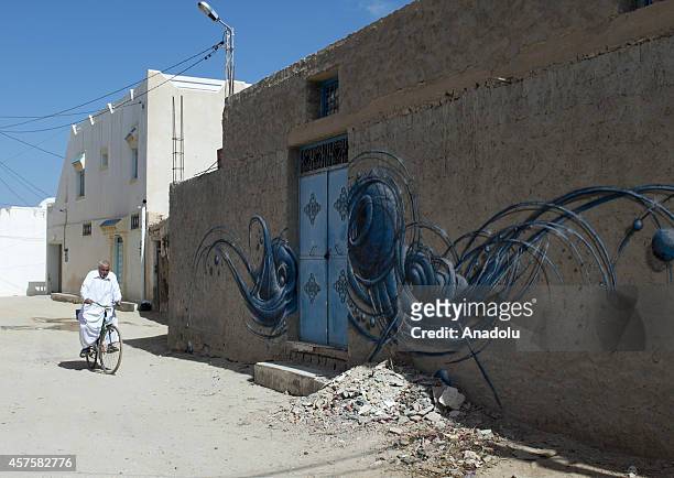 Three dimensional picture on a wall is seen in Djerba island of Tunisia, on October 17, 2014. Three dimensional pictures painted by the 150 street...
