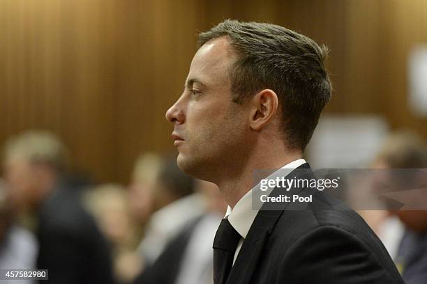 Oscar Pistorius listens to his judgement in the Pretoria High Court on October 21 in Pretoria, South Africa. Judge Thokozile Masipa handed down her...