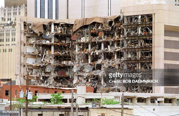 The north side of the Albert P. Murrah Federal Building in Oklahoma City shows 19 April 1995 the devastation caused by a fuel-and fertilizer truck...