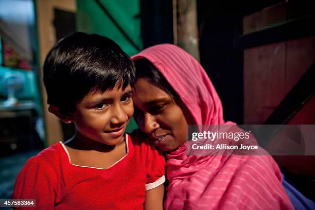 Year old former Kandapara brothel sex worker Maya hugs her daughter October 17, 2014 in Tangail, Bangladesh. When she was very young her parents got...