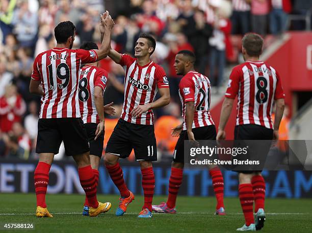 Jack Cork and Dusan Tadic of Southampton celebrate the fourth goal during the Barclays Premier League match between Southampton and Sunderland at St...