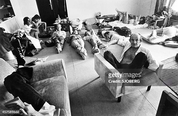 People who found shelter at the French Embassy in Phnom Penh rest in one of the room of the building late April 1975. On New Year's Day 1975,...