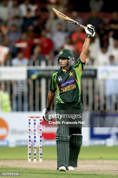 Mohammad Hafeez celebrates after reaching his century during the first One-Day International match between Sri Lanka and Pakistan at the Sharjah...