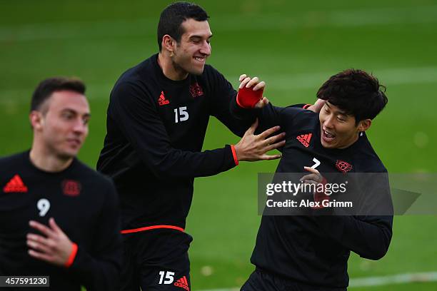 Levin Oeztunali and Heung-Min Son attends a Bayer Leverkusen training session ahead of their UEFA Champions League Group C match against Zenit...