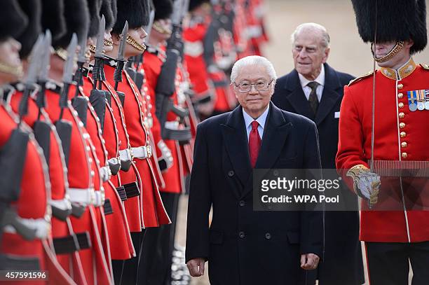 Singapore's President Tony Tan Keng Yam reviews an honour guard accompanied by Britain's Prince Philip, Duke of Edinburgh during the ceremonial...