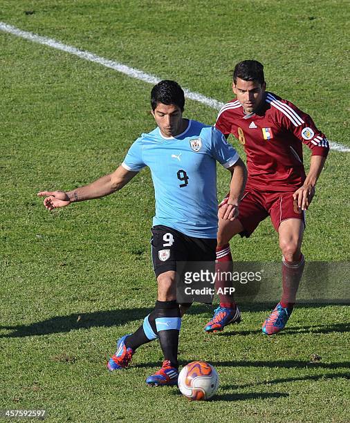 Uruguayan football player Luis Suarez controls the ball during the Brazil 2014 FIFA World Cup South American qualifier match Uruguay vs Venezuela...