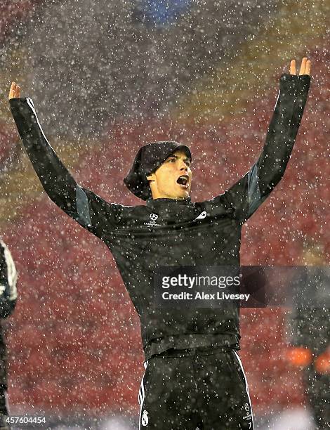 Cristiano Ronaldo of Real Madrid CF reacts as it rains during a training session at Anfield on October 21, 2014 in Liverpool, United Kingdom.
