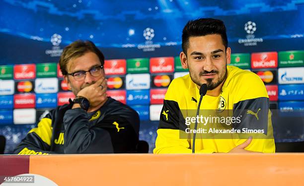 Head coach Juergen Klopp and his player Ilkay Guendogan of Borussia Dortmund during the press conference prior to their UEFA Champions League match...