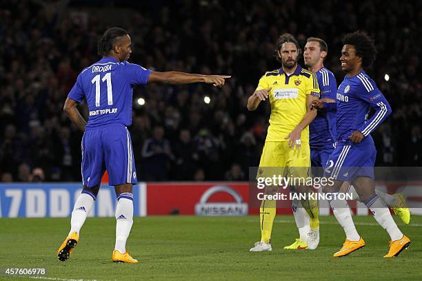 Chelsea's Ivorian striker Didier Drogba celebrates scoring their second goal from the penalty spot during the UEFA Champions League, Group G,...