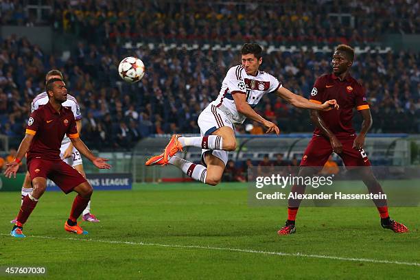 Robert Lewandowski of Bayern Muenchen scores his team's third goal during the UEFA Champions League group E match between AS Roma and FC Bayern...