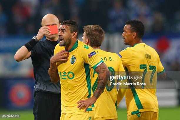 Mauricio Dos Santos Nascimento of Sporting Lisbon reacts as Referee Sergey Karasev shows him a red card during the UEFA Champions League Group G...