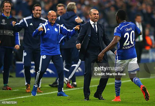 Chinedu Obasi of Schalke celebrates scoring their first goal Roberto Di Matteo, the manager of Schalke during the UEFA Champions League Group G match...