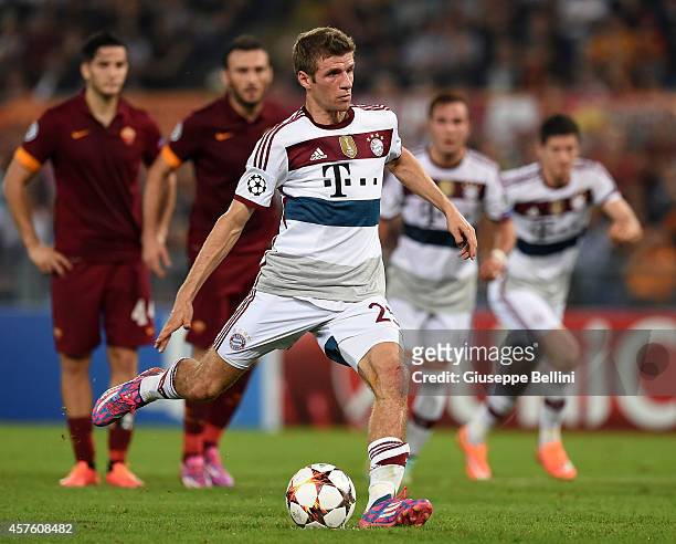 Thomas Muller of FC Bayern Muenchen takes the penalty and scores the goal 0-5 during the UEFA Champions League match between AS Roma and FC Bayern...