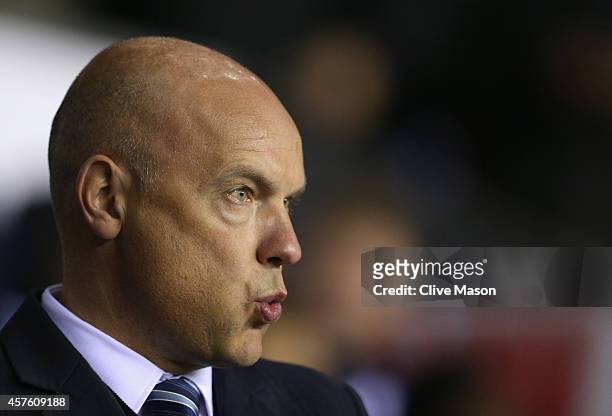 Uwe Rosler of Wigan looks on during the Sky Bet Championship match between Wigan Athletic and Millwall at DW Stadium on October 21, 2014 in Wigan,...