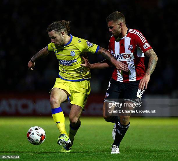 Stevie May of Sheffield Wednesday holds off Brentfords Harlee Dean during the Sky Bet Championship match between Brentford and Sheffield Wednesday at...