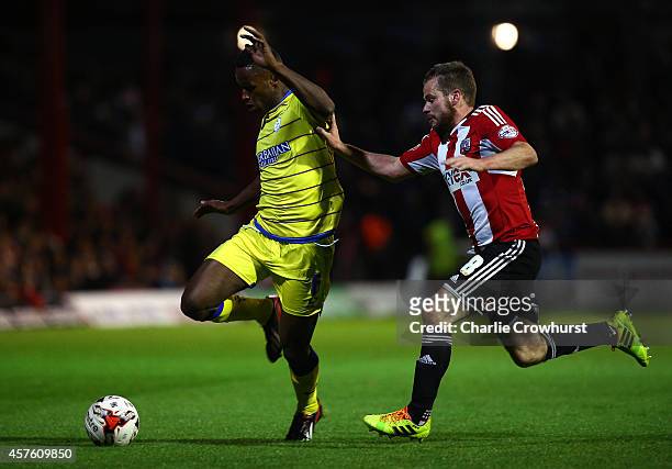 Jose Semedo of Sheffield Wednesday looks to get away from Alan Judge of Brentford during the Sky Bet Championship match between Brentford and...