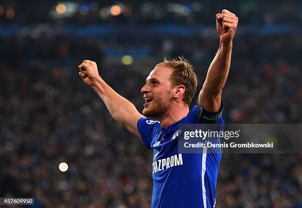 Benedikt Hoewedes of Schalke celebrates scoring their third goal during the UEFA Champions League Group G match between FC Schalke 04 and Sporting...