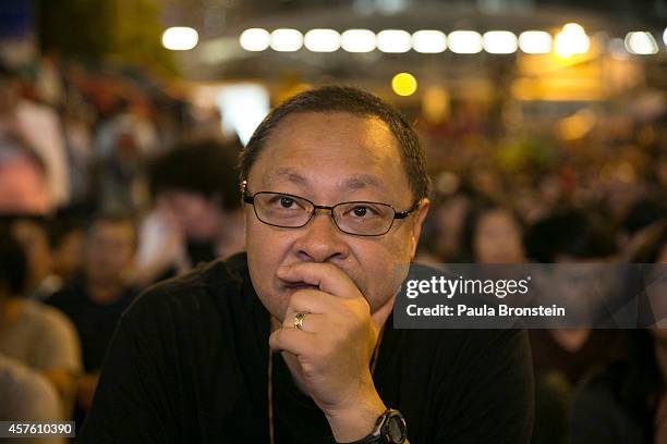 Benny Tai, Occupy Central founder watches as tens of thousands of protesters gathered to listen to the talks between the government officials and the...