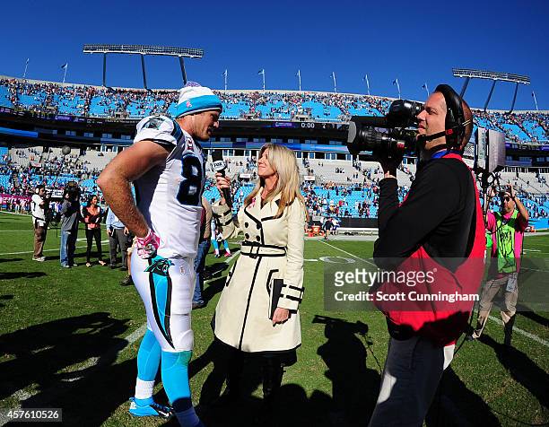 Greg Olsen of the Carolina Panthers is interviewed by Laura Okmin after the game against the Chicago Bears on October 5, 2014 at Bank of America...