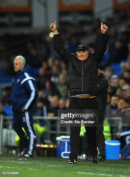 Cardiff manager Russell Slade celebrates as Ipswich manager Mick McCarthy looks on during the Sky Bet Championship match between Cardiff City and...