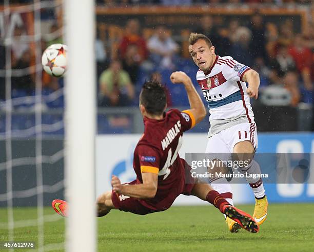 Xherdan Shaqiri of Bayern Muenchen scores his team's goal during the UEFA Champions League match between AS Roma and FC Bayern Munchen at Stadio...