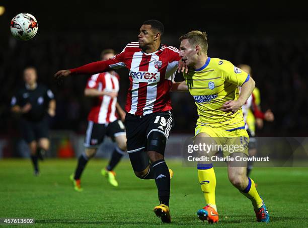 Andre Gray of Brentford holds off Sheffield Wednesdays Tom Lees during the Sky Bet Championship match between Brentford and Sheffield Wednesday at...