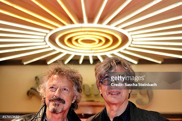Musician Wolfgang Niedecken and director Wim Wenders attend the premiere of the film 'Das Salz der Erde' at Lichtburg on October 21, 2014 in Essen,...