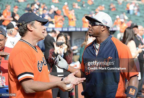 Mike Rowe, host of CNN's "Somebody's Gotta Do It," talks with Rajai Davis of the Detroit Tigers during batting practice prior to Game Two of the...