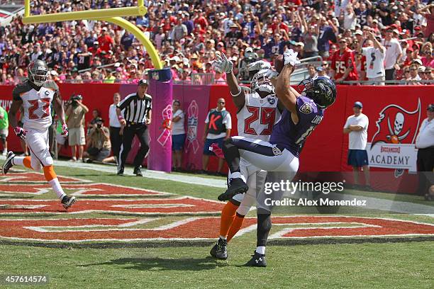 Wide receiver Michael Campanaro of the Baltimore Ravens makes a touchdown reception against Leonard Johnson of the Tampa Bay Buccaneers during an NFL...