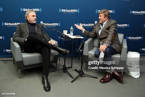 Singer-songwriter Neil Diamond and radio personality Bruce "Cousin Brucie" Morrow visit the SiriusXM Studios on October 21, 2014 in New York City.