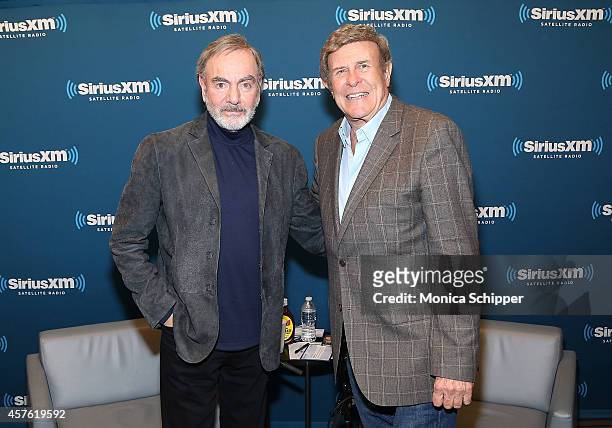 Singer-songwriter Neil Diamond and radio personality Bruce "Cousin Brucie" Morrow visit the SiriusXM Studios on October 21, 2014 in New York City.