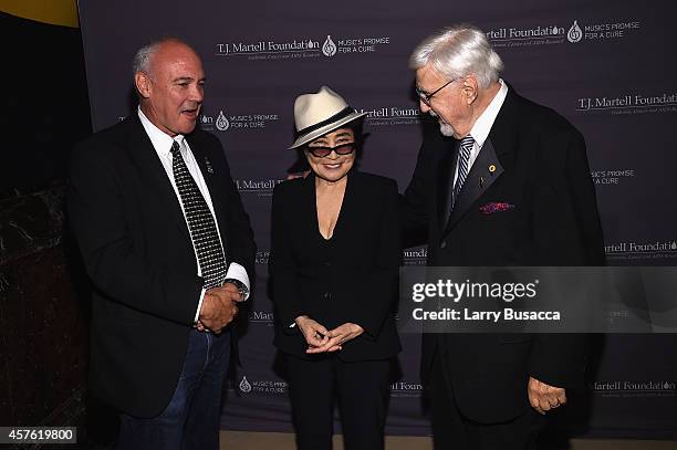 President and CEO, Hard Rock International Hamish Dodds, Yoko Ono, and T.J. Martell Foundation founder and chairman Tony Martell backstage at the...