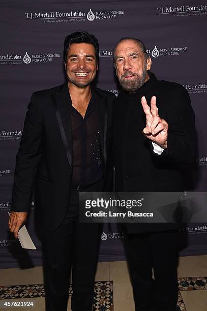 Singer Chayanne and Co-Founder, Chairman and CEO of John Paul Mitchell Systems and Co-Founder of Patron Tequila and Spirits John Paul DeJoria pose...
