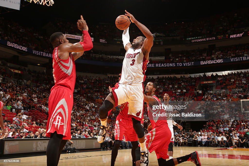 Houston Rockets Heating Up Dwyane Wade of the Miami Heat goes up for a shot against the Houston ...