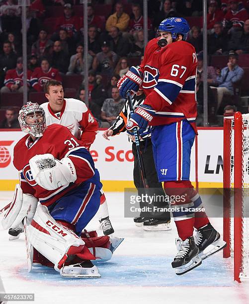 Max Pacioretty of the Montreal Canadiens receives a shot on his chest in front of the net against the Detroit Red Wings in the NHL game at the Bell...